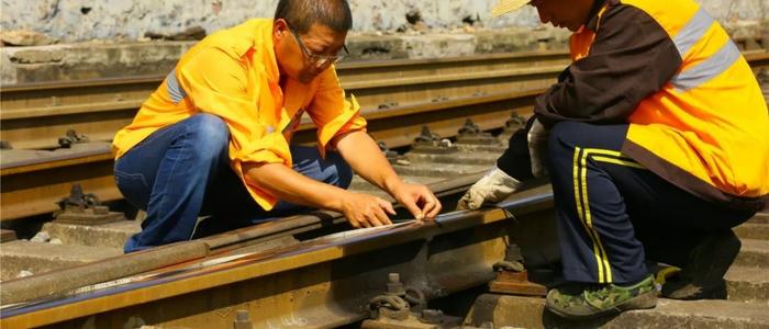 cleaning railroad tracks